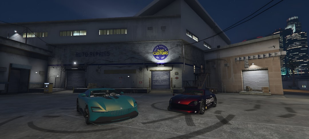 two-cars-parked-in-front-of-a-building-at-night-pk9tsjypmkg
